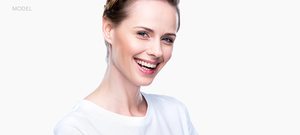 Female Model In White T-shirt Smiling and Squinting