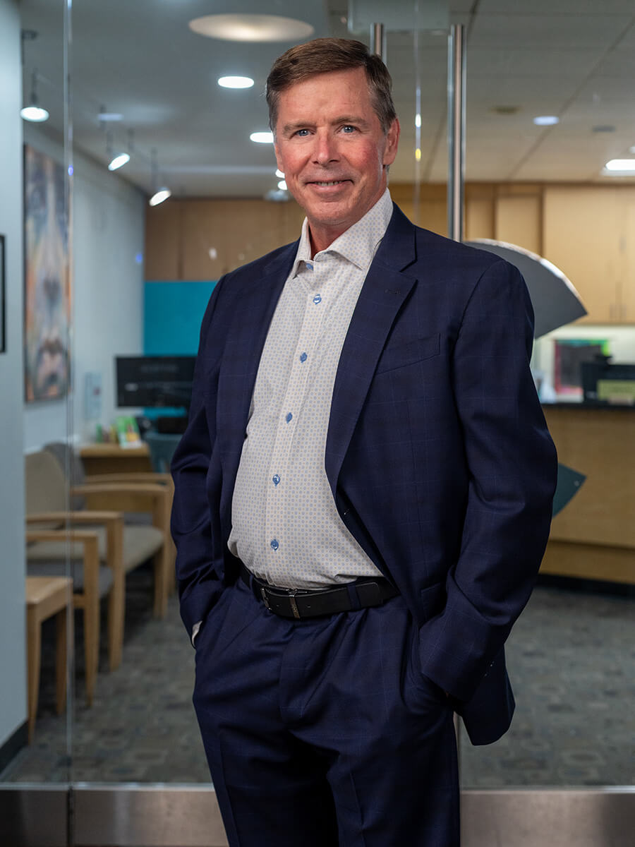 Dr. Emery in a blue suit