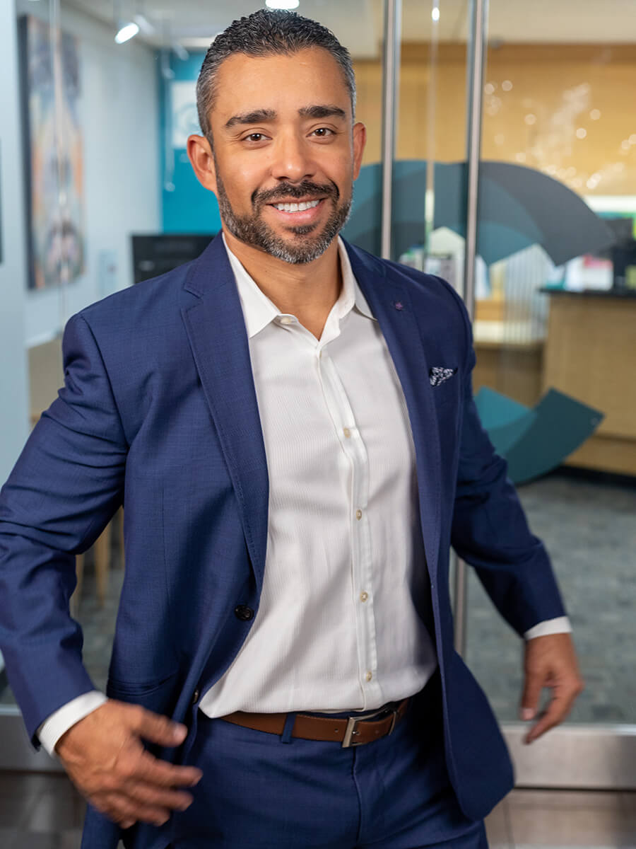 Dr. Retana in a blue suit