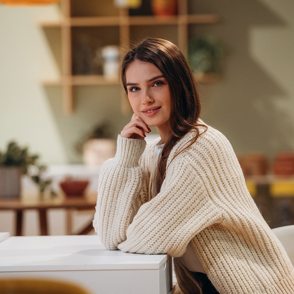 Woman sitting at a table at home