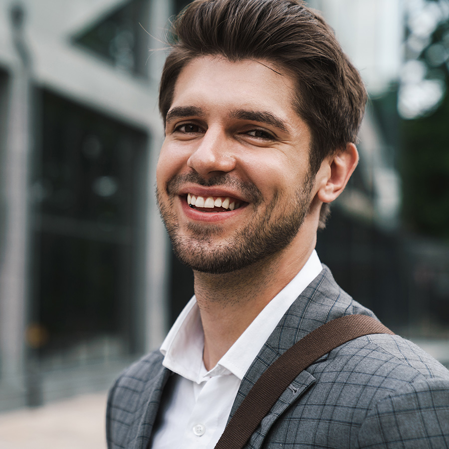 man in a suit smiling